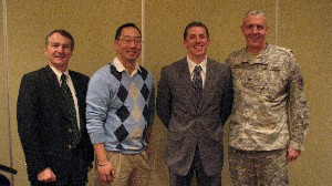 In December, Rod Pohlmann (l), chapter vice president, and Col. Michael Curry, USA (r), chapter president, recognize Andy Heo (2nd from l), Emerging Leader Award winner, and Eric LaPorte, Distinguished Young AFCEAN Award winner.